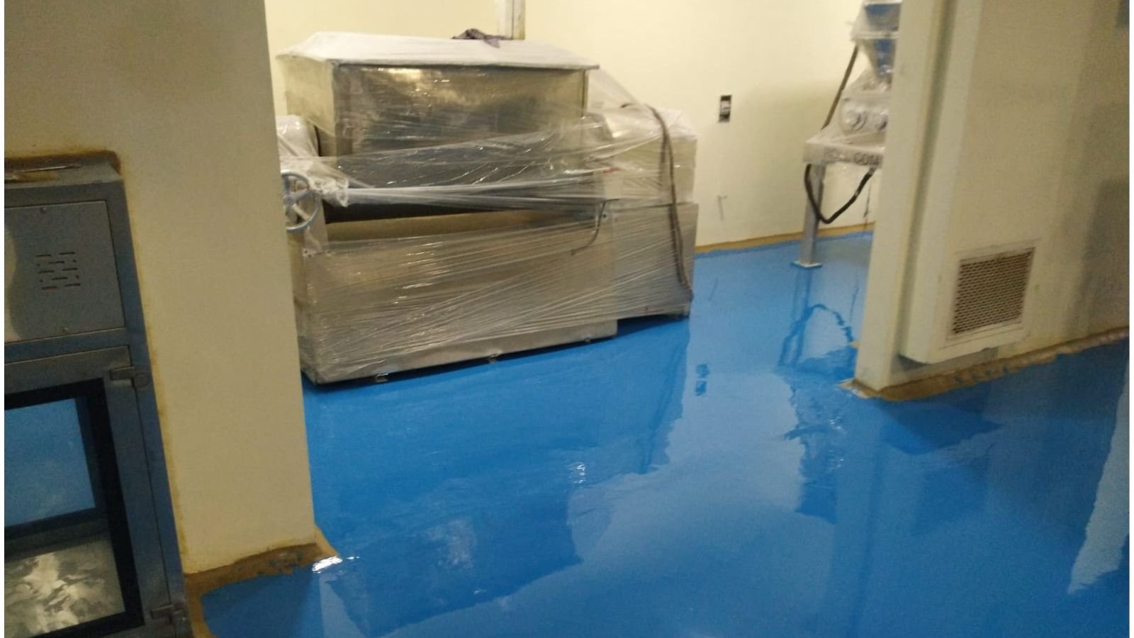 Granulation and drying area at the Sansarpur Terrace pharma plant with process vessel, tray dryers, control panels and material trolleys