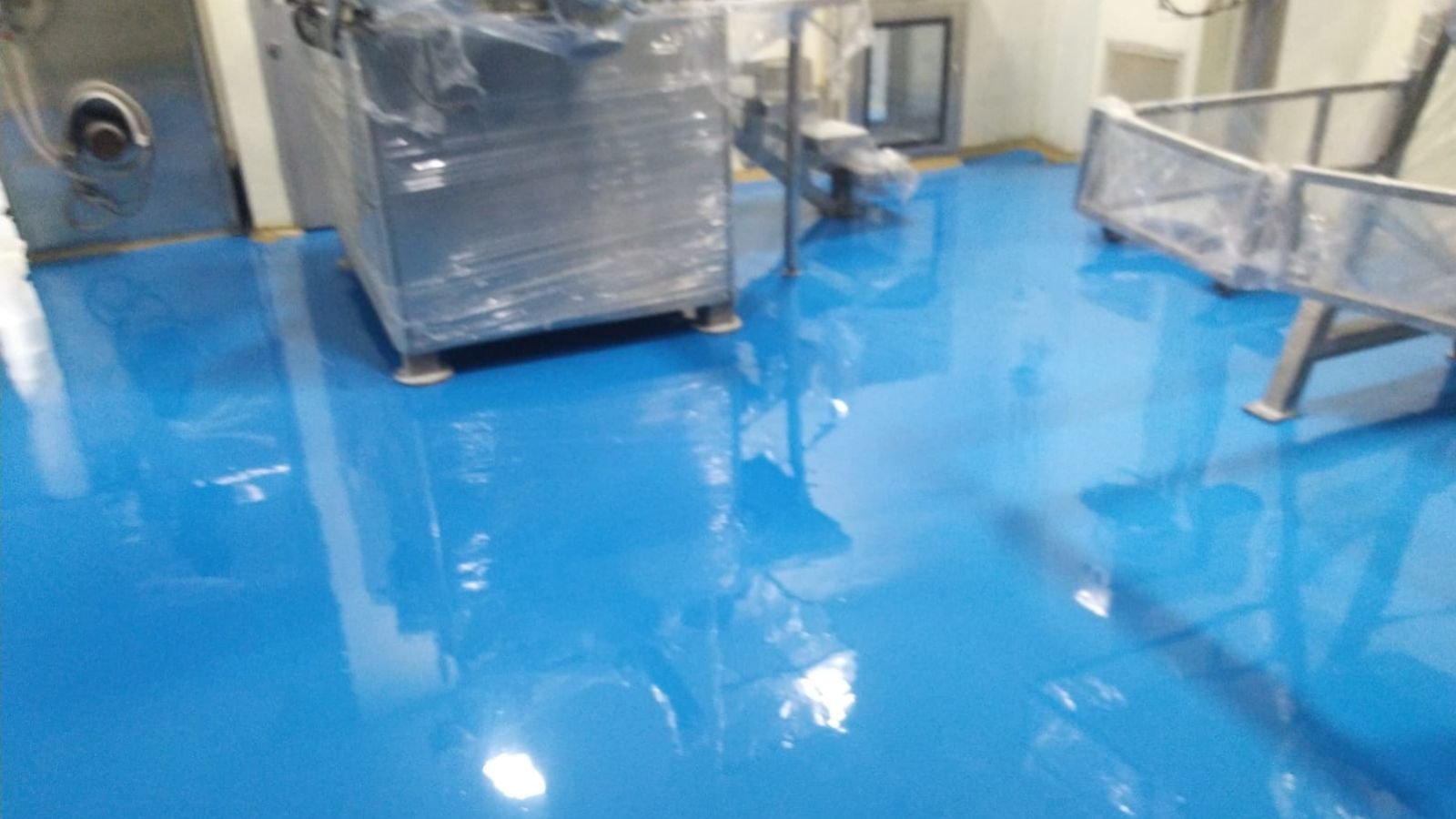 Pharma plant for sale in Sansarpur Terrace, Kangra — ground-floor manufacturing hall with newly laid seamless epoxy flooring