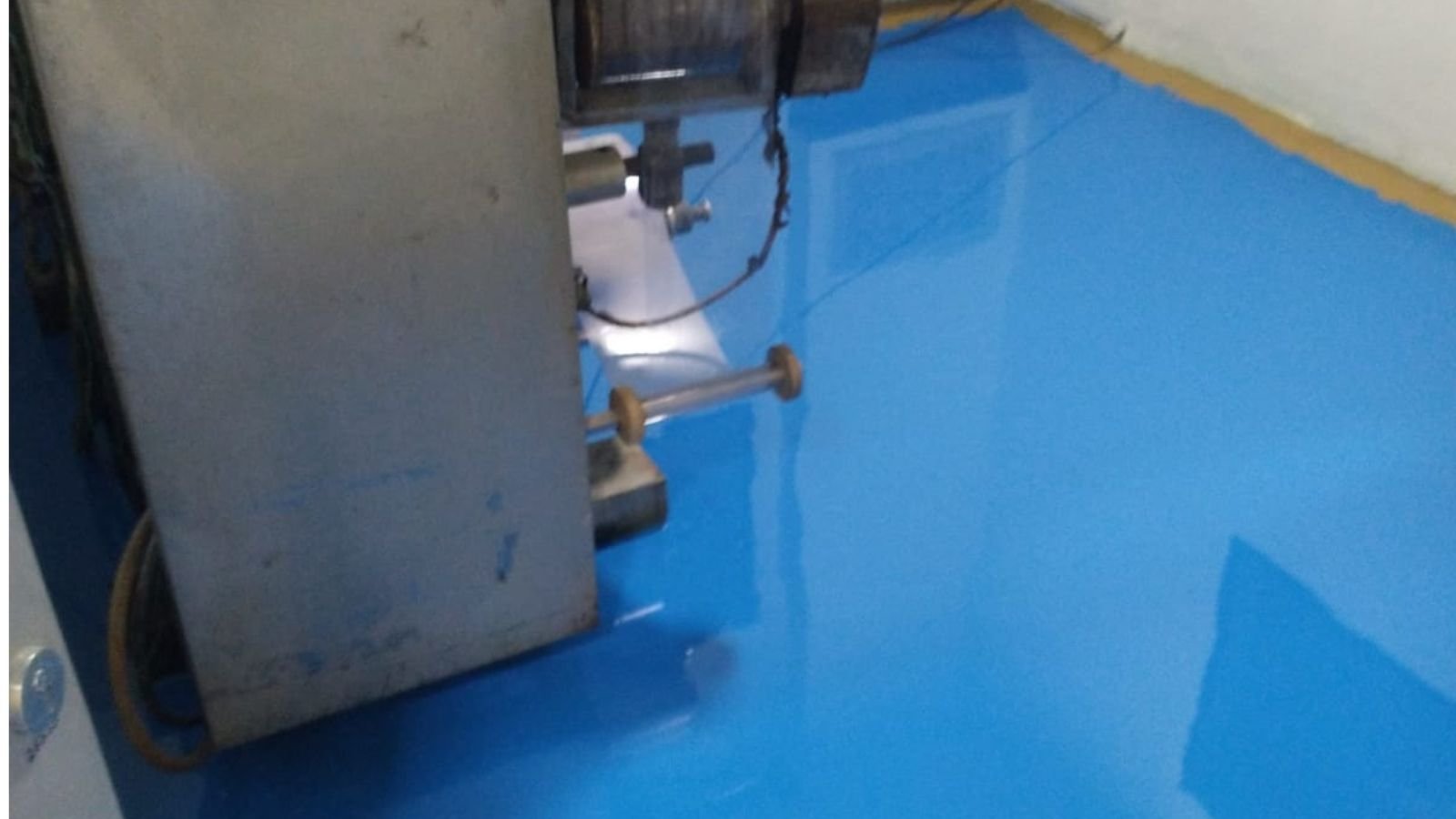 Packing section at the Sansarpur Terrace pharma plant with a strip packing machine in position on finished epoxy flooring